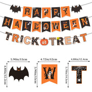 Zestaw dekoracji na imprezę halloweenową: baner „Happy Halloween”, girlanda „Trick or Treat”, wiszące pajączki, ozdoby na babeczki, balony